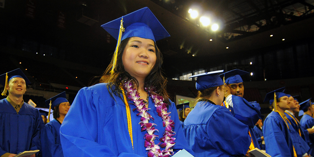 Community college students at graduation