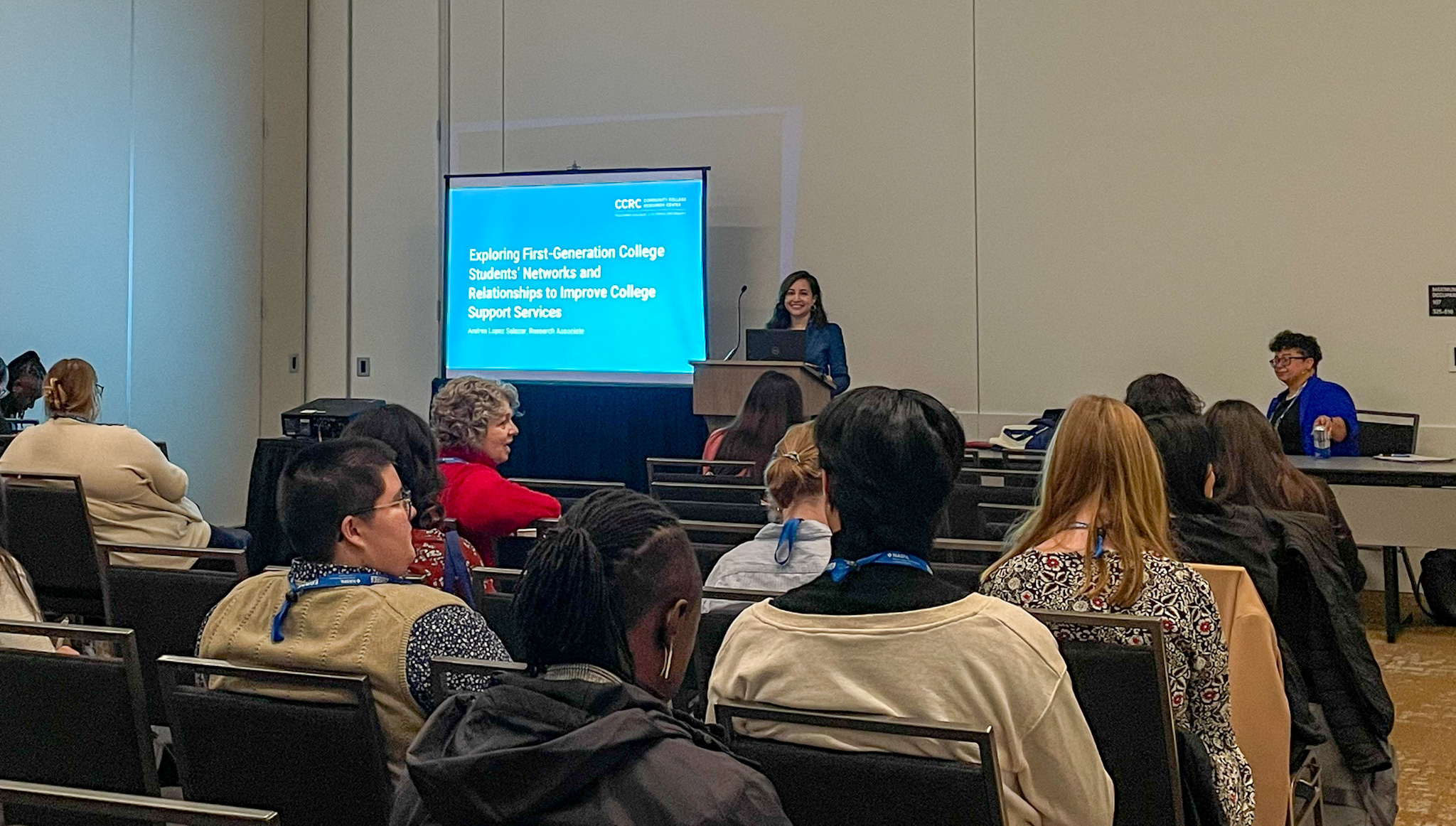 Andrea Lopez Salazar presenting in front of an audience