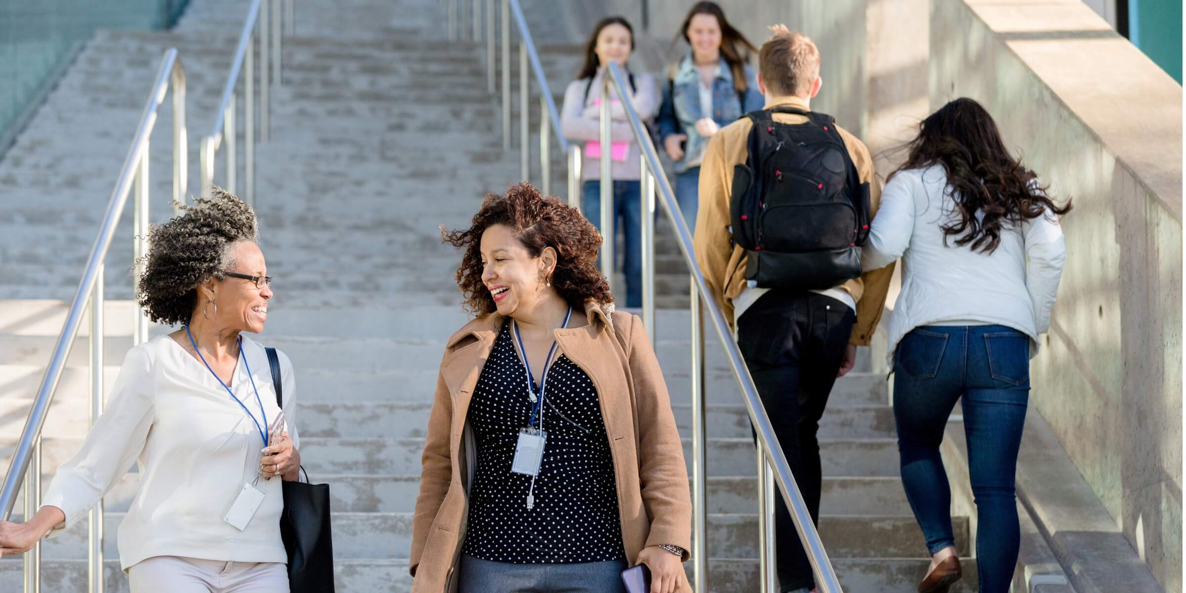 female college professors walk together on campus picture id1212211529 1