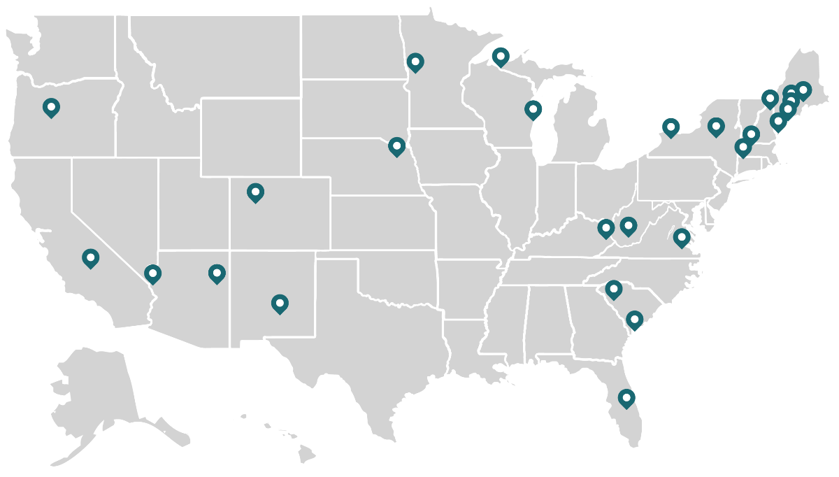 A map of the United States with teal markers indicated participating institute colleges