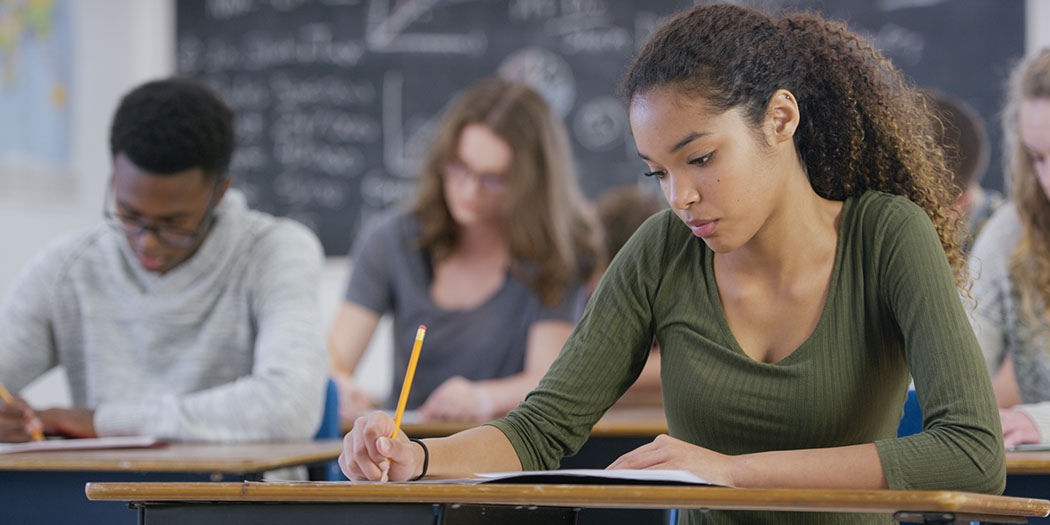 high school students working in class