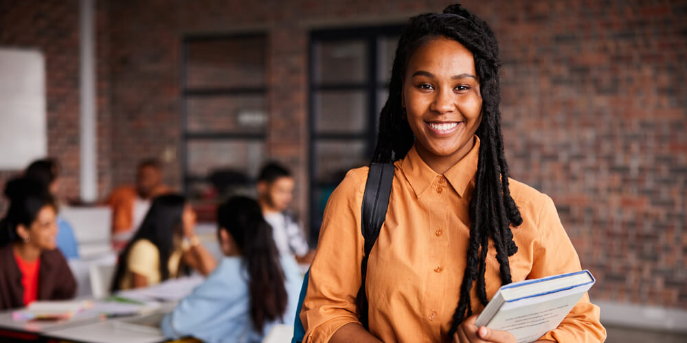 Student smiles in classroom