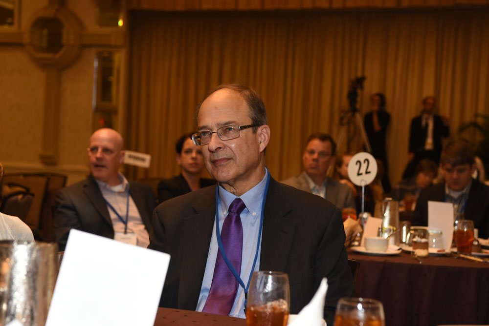 Jim Jacobs listens at a presentation