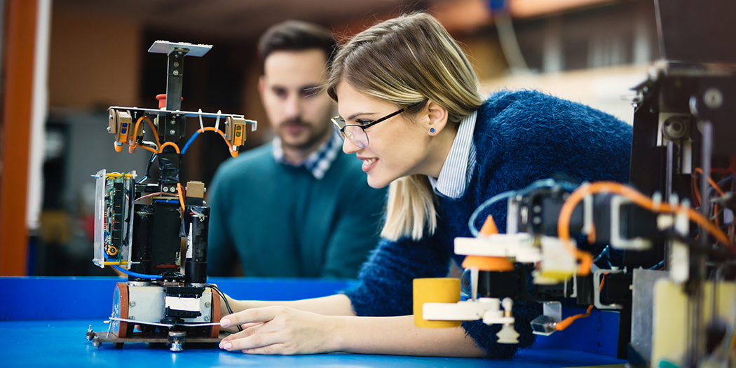 Students working in a robotics classroom