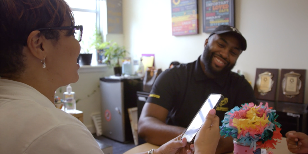 A student smiles in the middle of an advising appointment