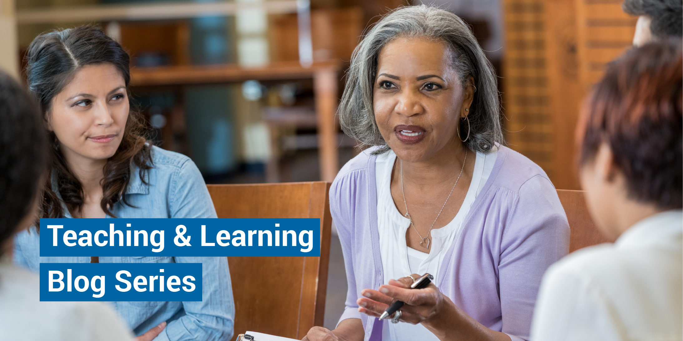 A woman leads a small group discussion. The words Teaching & Learning Blog Series appear in the lower left corner of the image